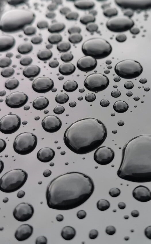 A close up of water drops on the surface